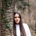 Maja Vrčon profile photo, leaning on a wild cherry in autumn forest