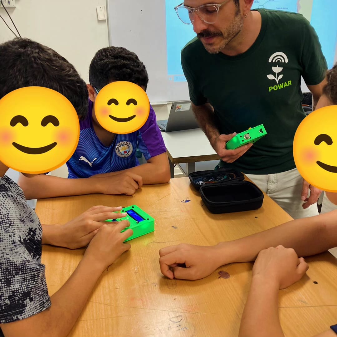 Kids learning how to use the P-Bit to collect environmental data
